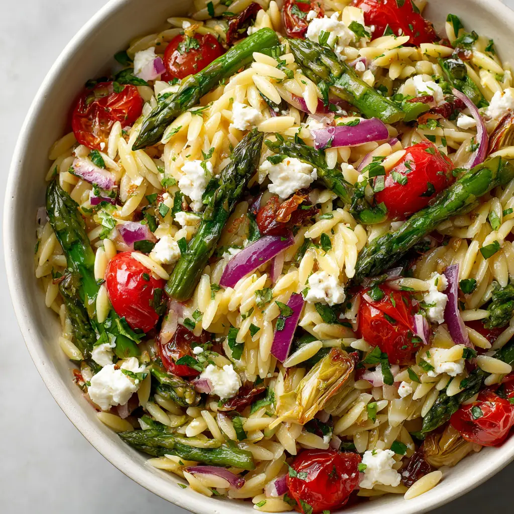 Orzo Salad (The Ultimate Mediterranean Recipe) 2 A close-up of the orzo salad showcasing the texture of the cooked orzo, fresh dill, and crumbled feta cheese.