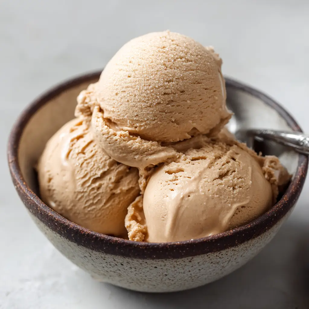 Italian Coffee Gelato: The Ultimate Recipe for Authentic Flavor 3 An extreme close-up of a scoop of homemade espresso gelato, highlighting its smooth, creamy texture and deep coffee color.