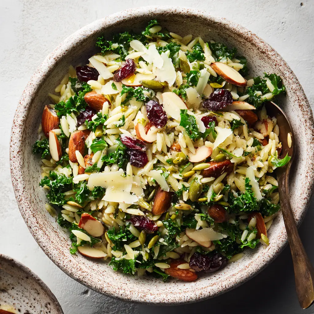 Massaged curly green kale tossed with tender orzo pasta and a glistening light vinaigrette.
